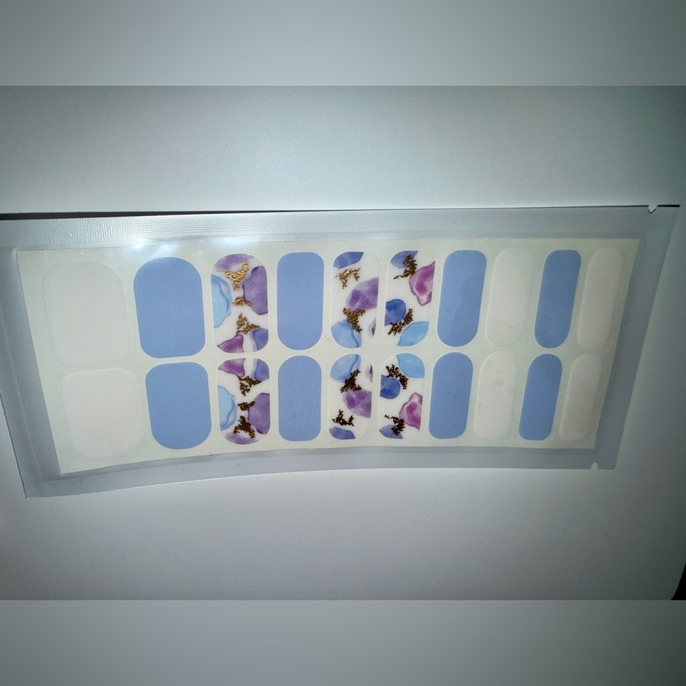 Floral Nail Wraps in Blue, White, and Purple.